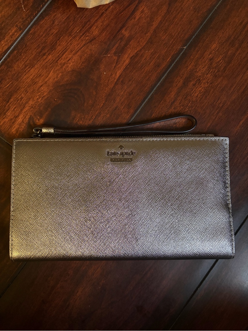 kate spade metallic silver wristlet clutch